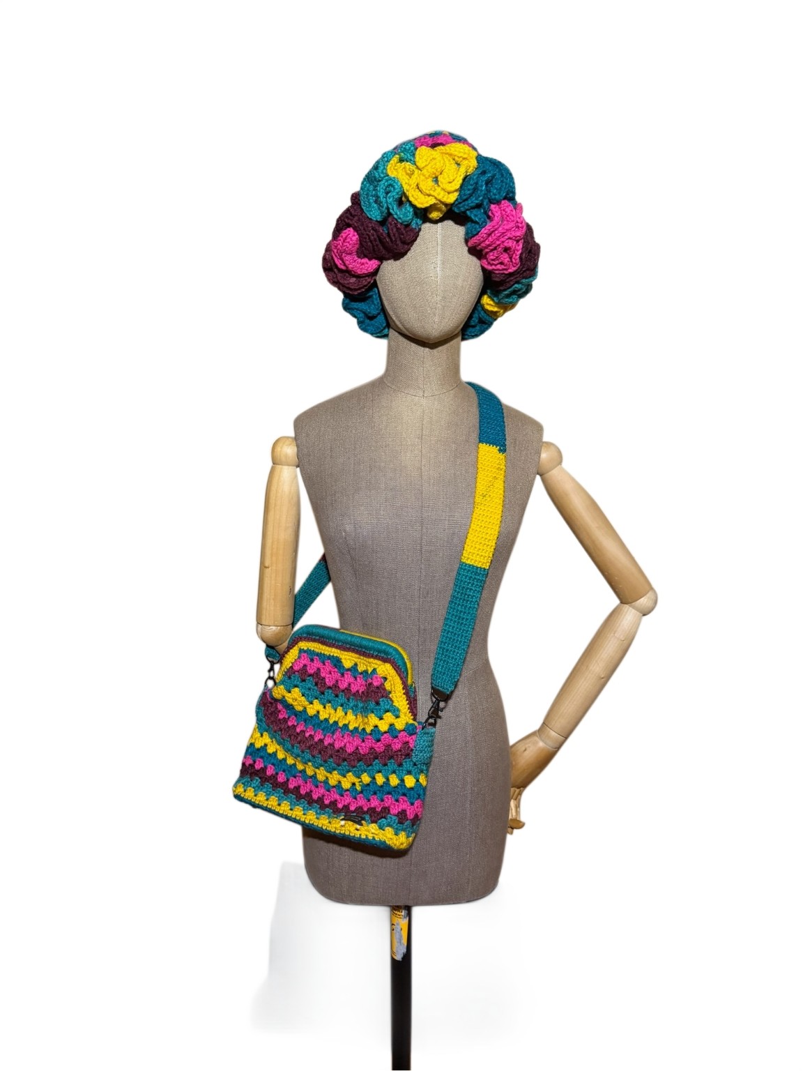 Color Pop Bag and coordinating ruffled hat displayed together on a mannequin against a white background