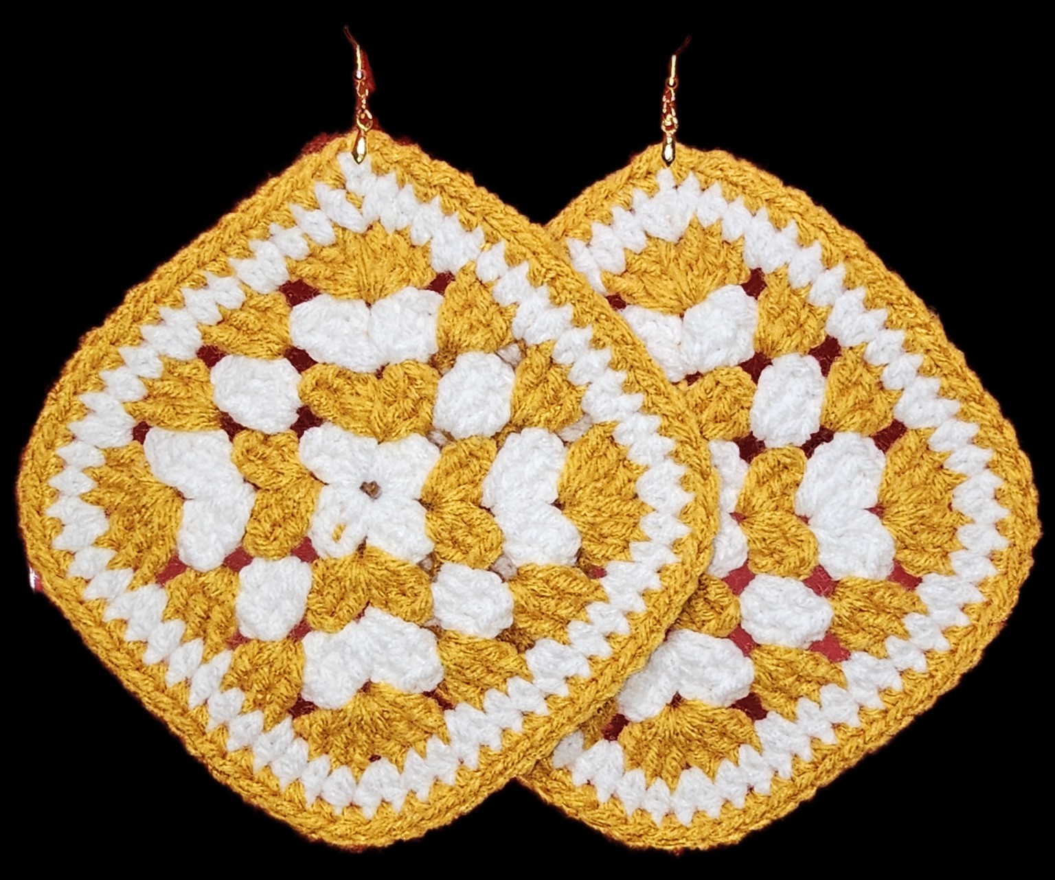 Pair of coordinating gold and white crochet statement earrings