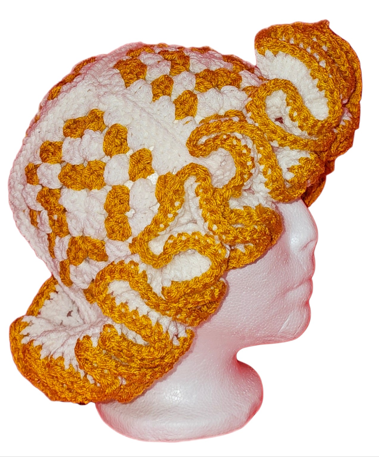 Gold and white crochet hat with a large sculptural ruffled brim, side view