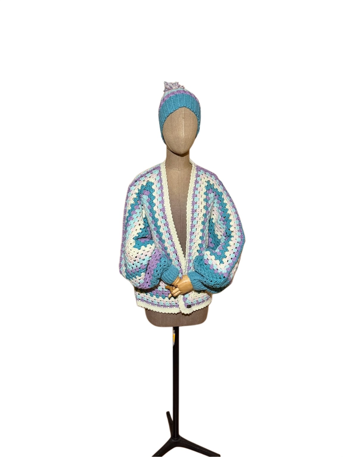 Sandy in Pastel Dreams cardigan and coordinating pom-pom hat displayed on a mannequin against a white background